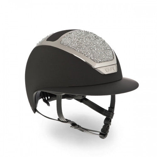 The Dogma Star Lady On The Rockss is an innovative equestrian helmet with pleasing aesthetics designed specifically for women riders.   Each one is individually handcrafted in Italy. The sparkling details can be applied on all the helmets of KASK equestrian collection.  KASK’s patented self-adapting adjustment system, introduced for the first time in the equestrian market, allows the helmet to fit the rider’s head perfectly and automatically by gently cradling the back of the head. It is highly popular amon